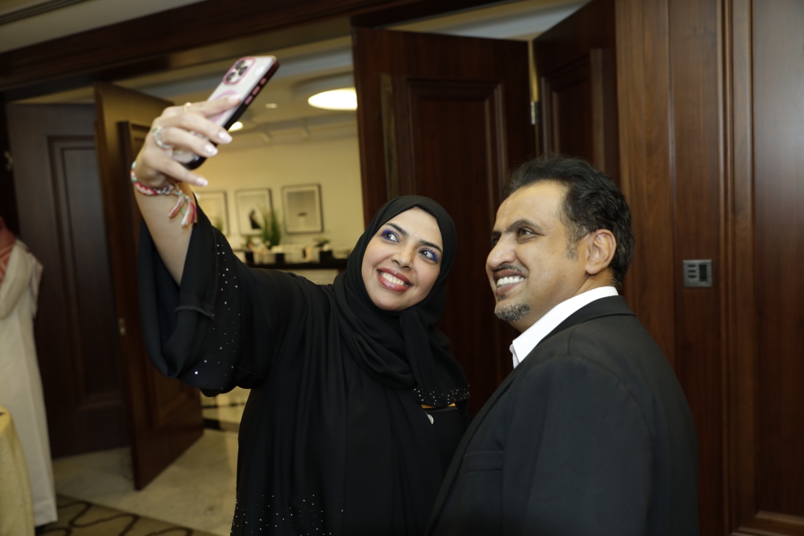 Attendee taking a selfie with Mohammed Qahtani